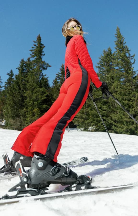 Skiing in a red one-piece suit