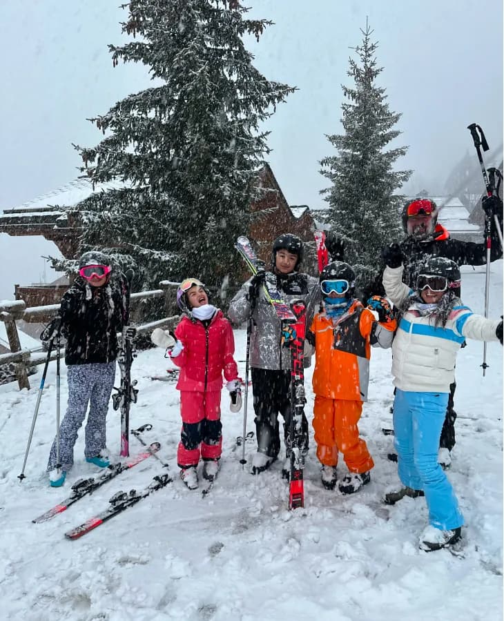 A group of happy young skiers in the snow